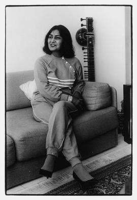 Mrs. Ameena Cachalia, political activist, sitting on her couch