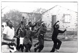 UDF-AZAPO peace talks - youth run through the streets of a township after meeting