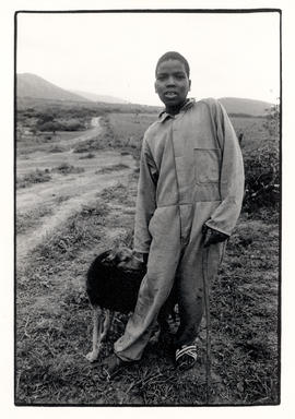 Boy with dog in Ntambana,a  relocation area near Empangeni