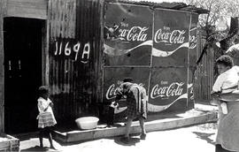 Shack with Coca Cola advertisement on the wall in Crossroads, one of Cape Town's squatter camps