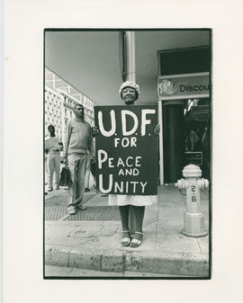 Dorothy Nyembe holding a UDF poster during a protest