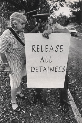 Black Sash activist with sign 'Release all detainees'