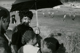 Winnie Mandela watches the Mandela Football Club play their debut match in Orlando West